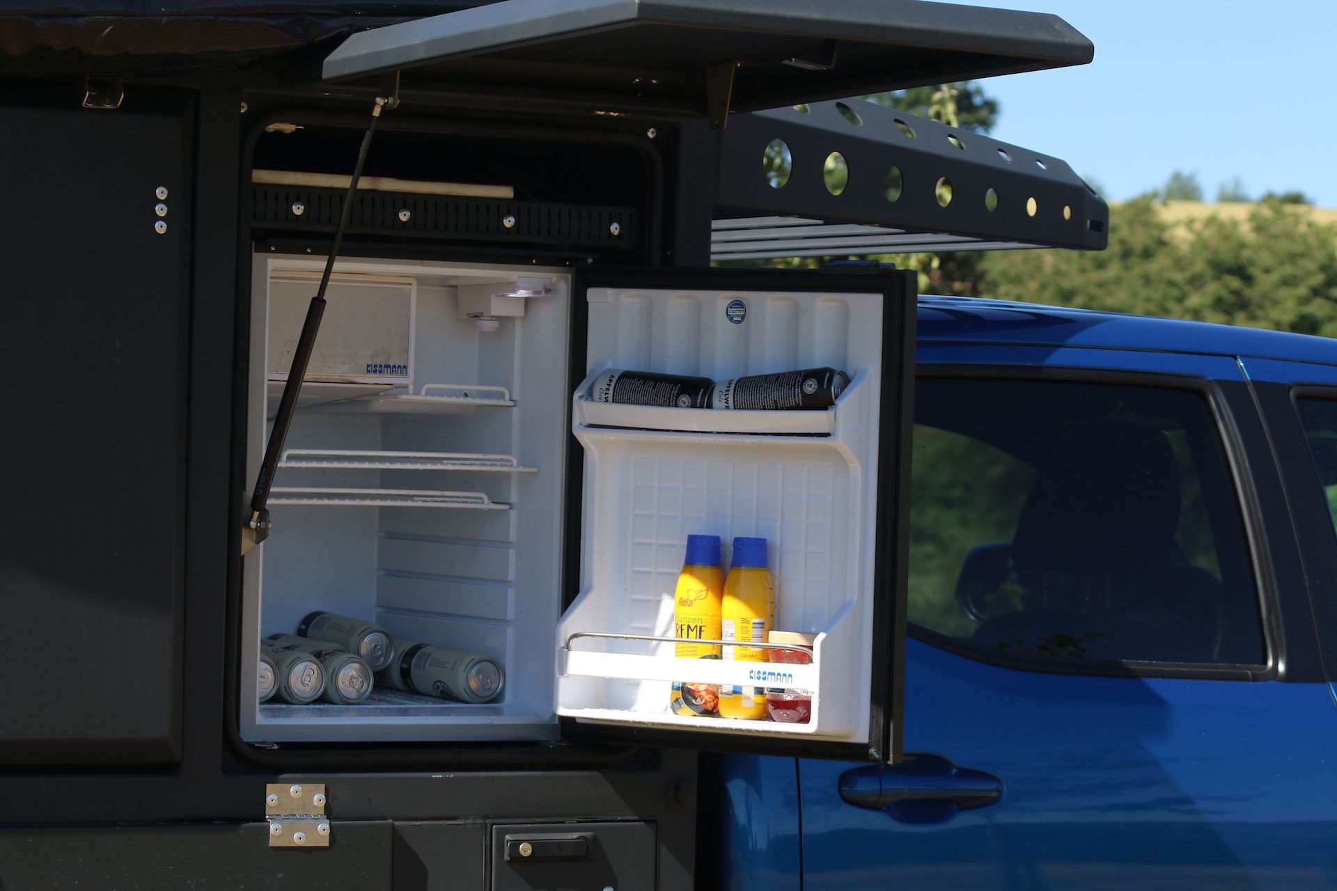 toyota hilux gets upgraded as 4WD camper with queen-sized bed and pull-out  breakfast bar