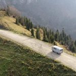 UAZ Buhanka on mountain road drone shot